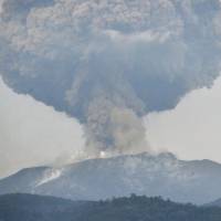 A volcanic plume is seen coming from Mount Shinmoe in Kagoshima on Monday. | KYODO