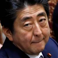 Prime Minister Shinzo Abe attends at an Upper House parliamentary session in Tokyo on Wednesday. | REUTERS