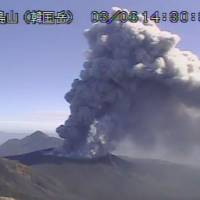 Footage taken by a weather agency camera Tuesday afternoon shows plumes of smoke billowing from Shinmoedake, a volcano  straddling Kagoshima and Miyazaki prefectures. | KYODO