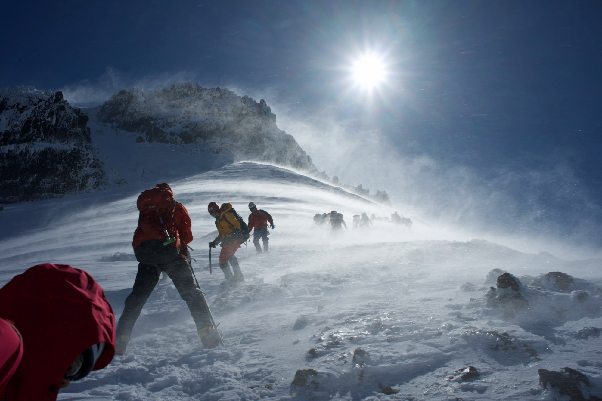 Time's up: 100 kph winds on Mount Aka force climbers to descend the mountain. | OSCAR BOYD