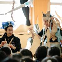 Play for Tohoku: Acchi Cocchi\'s Mikako Atsuchi (left)and a member of  Polyglot Theatre visit a school in Minamisanriku, Miyagi Prefecture, last month. | AI UEDA
