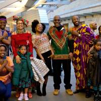 Baye McNeil (standing, fifth from left) and others assemble at Roppongi Hills in Tokyo on March 3 for a \"Black Panther\" viewing party. | ALEKSANDER DRAGICEVIC