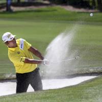 Hideki Matsuyama chips for a birdie from the bunker at the first green during the second day of the Arnold Palmer Invitational in Orlando, Florida, on Friday. | AP