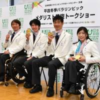 (From left) Taiki Mori, Gurimu Narita, Yoshihiro Nitta and Momoka Muraoka are pictured at a talk show for Pyeongchang Paralympic medalists in Tokyo on Tuesday. | YOSHIAKI MIURA