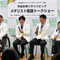Pyeongchang Paralympic medalists (from left) Taiki Mori, Gurimu Narita, Yoshihiro Nitta and Momoka Muraoka discuss their experiences at the games during a talk show in Tokyo on Tuesday. YOSHIAKI MIURA | YOSHIAKI MIURA
