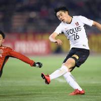Urawa\'s Takuya Ogiwara shoots during Reds\' win over Nagoya on Wednesday night. | KYODO