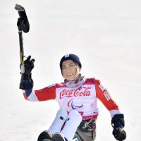 Momoka Muraoka reacts after capturing the bronze medal in the women\'s super combined on Tuesday at the Pyeongchang Paralympics. | KYODO