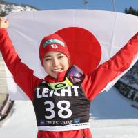 Ski jumper Sara Takanashi celebrates after capturing her record 54th World Cup victory with jumps of 100.5 and 96.5 meters on Saturday in Oberstdorf, Germany. | KYODO