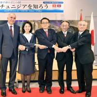 Japanese and Tunisian artists pose for a photograph during the opening ceremony of an exhibition titled \"Inspiring Tunisia\" at Chiyoda Kumin Hall on March 12. Pictured (from left) are Tunisian Ambassador Kais Darragi; Foreign Minister Taro Kono\'s wife, Kaori; Kiyoshi Ejima, chairman of the Special Committee on Reconstruction after the Great East Japan Earthquake and member of the Japan-Tunisia Parliamentary Committee; artist Hideyuki Ozawa; and Chiyoda Mayor Masami Ishikawa. The exhibition      is on display through      March 22. yoshiaki miura | YOSHIAKI MIURA