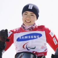 Momoka Muraoka celebrates after winning the women\'s Alpine skiing giant slalom at the Pyeongchang Paralympics on Wednesday. The win gave Japan its first gold of the games and Muraoka her fourth medal. | KYODO