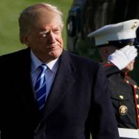 U.S. President Donald Trump makes his way across the South Lawn upon returning to the White House on Thursday in Washington. | AFP-JIJI