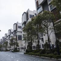 Apartment buildings stand in Discovery Bay, a residential project developed by Hong Kong Resort Co., on Lantau Island in Hong Kong, China, on March 27. Private homes in Discovery Bay currently sell from about HK&#36;8 million to HK&#36;80 million, said Denis Ma, head of research for Hong Kong at real-estate services company Jones Lang LaSalle Ltd. | BLOOMBERG