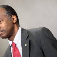 U.S. Secretary of Housing and Urban Development Ben Carson waits to speak during an event to honor the 50th anniversary of the Fair Housing Act at the Department of Justice Thursday in Washington. | AFP-JIJI