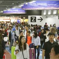 Terminal 3 at Narita airport is filled with people on Saturday. | KYODO