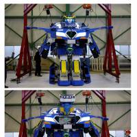 The J-deite Ride robot, which can turn into an electric car, is demonstrated during its unveiling at a factory near Tokyo on Wednesday. | REUTERS