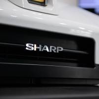 Sharp Corps.\'s SV-S500 automated unmanned ground vehicle stands on display. The integration of Sharp\'s two Malaysian arms will help make decision-making processes more efficient, says Tadashi Oyama, managing director of the marketing unit. | BLOOMBERG