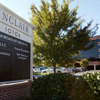 Sinclair Broadcast Group, Inc.\'s headquarters stands in Hunt Valley, Maryland, in 2004. President Trump is jumping to the defense of the Sinclair Broadcast Group, which is under fire following the rapid spread of a video showing anchors at its stations across the country reading a script criticizing \"fake\" news stories. Trump tweeted Monday that it was funny to watch \"Fake News Networks\" criticizing Sinclair for being biased. | AP