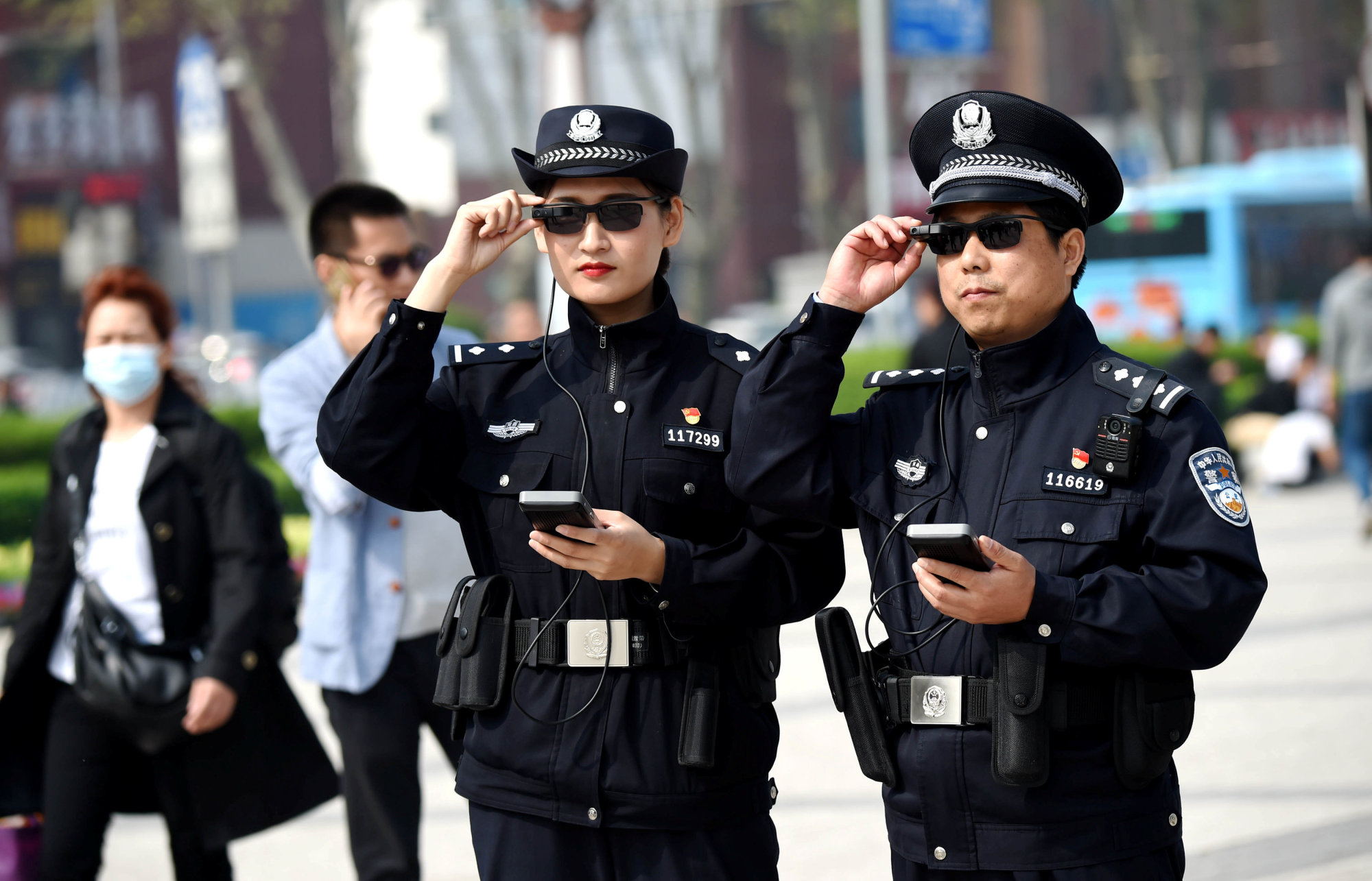 Police officers display AI-powered smart glasses in Luoyang, in China's Henan province, earlier this month. | REUTERS
