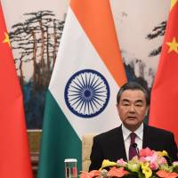 Indian Foreign Minister Sushma Swaraj, left, and Chinese Foreign Minister Wang Yi hold a news conference after their meeting at the Diaoyutai State Guest House in Beijing on Sunday. /AFP-JIJI | AFP-JIJI