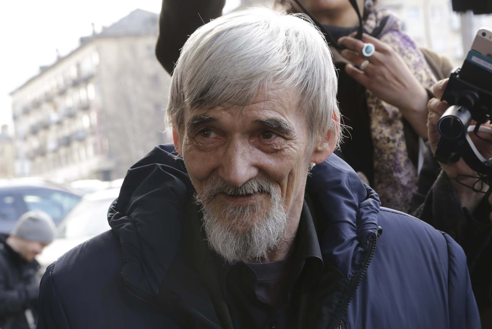 Historian Yuri Dmitriev speaks Thursday outside a court building in Petrozavodsk, Russia. | REUTERS