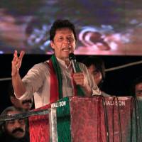 Opposition leader Imran Khan speaks to supporters during a celebration rally after the Supreme Court disqualified Prime Minister Nawaz Sharif in Islamabad last July. | REUTERS