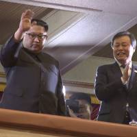 North Korean leader Kim Jong Un waves as South Korean Culture, Sports and Tourism Minister Do Jong-whan claps during a performance by a South Korean art troupe in Pyongyang in this image taken from video Sunday. | AP
