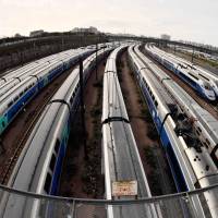 High-speed TGV trains stand stationary on tracks outside the Gare de Lyon station in Paris on Wednesday, the second day of three months of rolling strikes by the French public railway service, SNCF. | AFP-JIJI