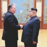 Then-CIA Director Mike Pompeo meets with North Korean leader Kim Jong Un in Pyongyang in a photo  taken over Easter weekend. | U.S. GOVERNMENT / VIA REUTERS