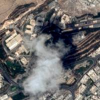 This handout satellite image taken on April 11 and provided on Sunday by Distribution Airbus DS shows the Scientific Studies and Research Centre (SSRC) compound in the Barzeh district, north of Damascus, before the raids by the United States, Britain and France. | CNES 2017, DISTRIBUTION AIRBUS DS / HANDOUT / VIA AFP-JIJI