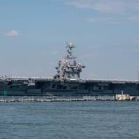 The aircraft carrier USS Harry S. Truman departs with its strike group toward the Middle East from Naval Station Norfolk, Virginia, Wednesday. | U.S. NAVY / MASS COMMUNICATION SPECIALIST 3RD CLASS DANNY RAY NUNEZ JR. / HANDOUT / VIA REUTERS