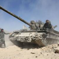 Pro-Syrian regime forces advance toward the town of Douma, the last opposition holdout in eastern Ghouta, on Saturday, after they resumed a military blitz to pressure rebels to withdraw. | AFP-JIJI