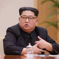 North Korean leader Kim Jong Un heads a party meeting in this photo released Tuesday. | KCNA / VIA REUTERS