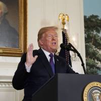 U.S. President Donald Trump announces military strikes on Syria while delivering a statement from the White House in Washington on Friday. | REUTERS