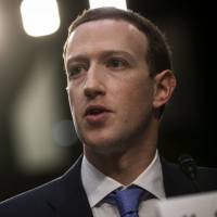 Facebook founder Mark Zuckerberg speaks during a joint hearing of the Senate Judiciary and Commerce committees on Tuesday. | BLOOMBERG