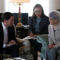 Sakie Yokota (right), mother of Megumi Yokota, who was abducted by North Korea agents at age 13 in 1977, meets U.S. Ambassador to Japan William Hagerty in Tokyo on Tuesday. | REUTERS