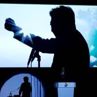 Prime Minister Shinzo Abe delivers a speech during the Liberal Democratic Party\'s annual convention in Tokyo in March. Despite plunging public approval ratings, support for Abe is still strong among businesses. | REUTERS
