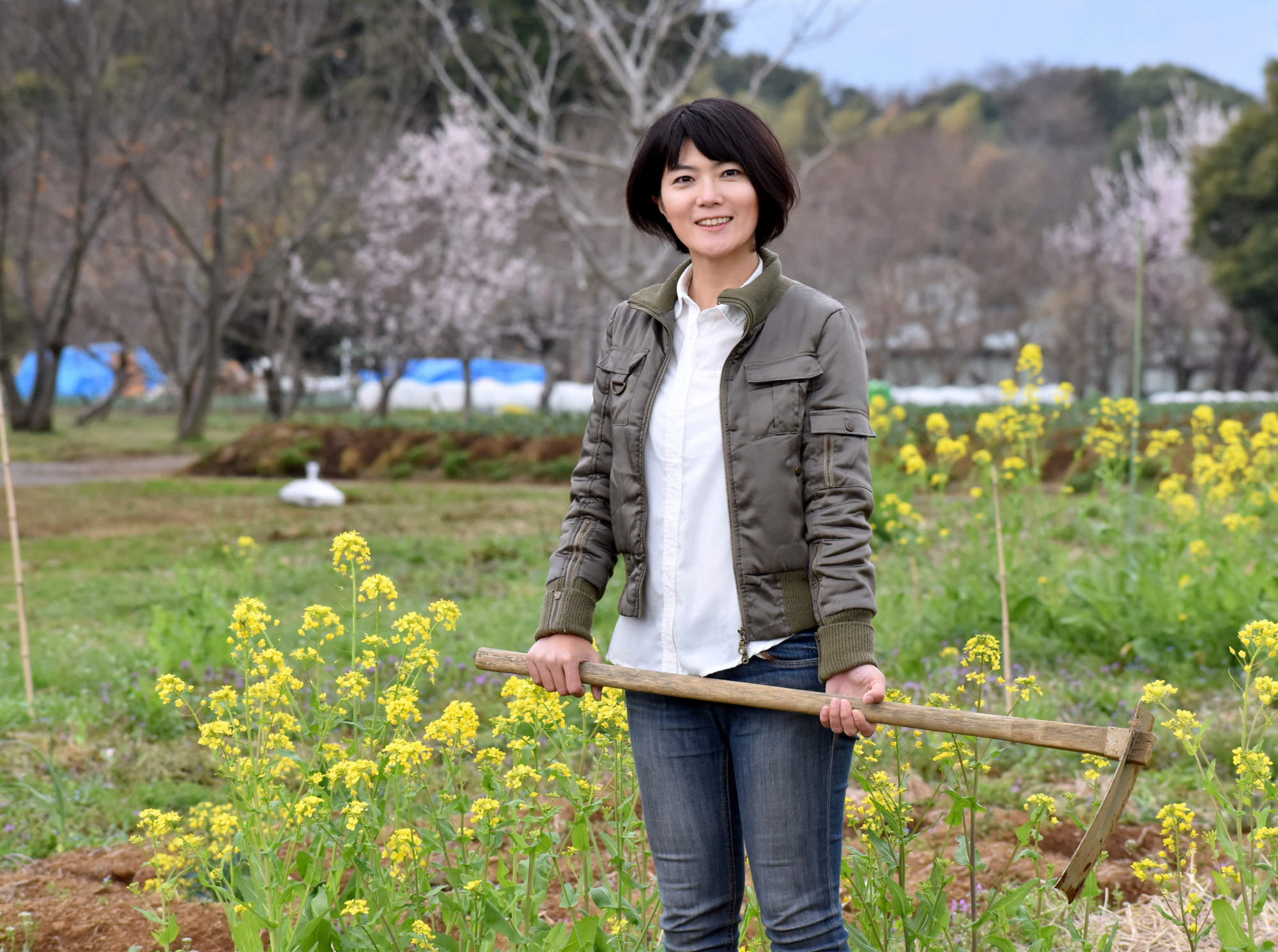 Kiyoko Ojima, who helps homeless and other needy people by giving them opportunities to work in agriculture, is seen at her field in Fujisawa, Kanagawa Prefecture, on March 19. | SATOKO KAWASAKI .
