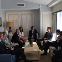 U.S. Ambassador to Japan William Hagerty (center) speaks with Japanese and U.S. officials at the Mar-a-Lago estate in Florida on Wednesday. | U.S. STATE DEPARTMENT