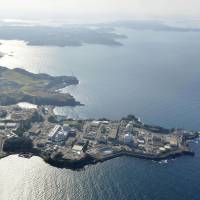 The Genkai nuclear power plant in Saga Prefecture is seen in this aerial photo taken in 2016. Kyushu Electric Power Co. said Sunday that  technicians had found a 1-cm hole in a pipe that is believed to have caused a small steam leak at the plant\'s No. 3 reactor. | KYODO