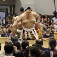 Yokozuna Kisenosato performs a ring-entry ceremony during a spring sumo tour on Thursday in Saitama. | KYODO