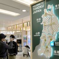 A panel highlighting prefectures in the Tohoku region is seen at Sendai Airport in April last year. | KYODO