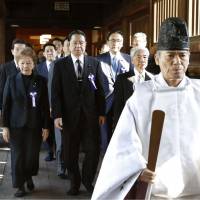 A nonpartisan group of lawmakers visit the war-linked Yasukuni Shrine in Tokyo on Friday. | KYODO