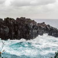 Rugged rocks: A torrid sea crashes against the jagged cliffs that jut out into 	Sagami Bay, Shizuoka Prefecture. | ANDREW CURRY