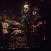 Behind the black curtain: A drummer sits behind layers of fabric during a performance of Koshiro Hino\'s \"Geist.\" | ERIK LUEBS