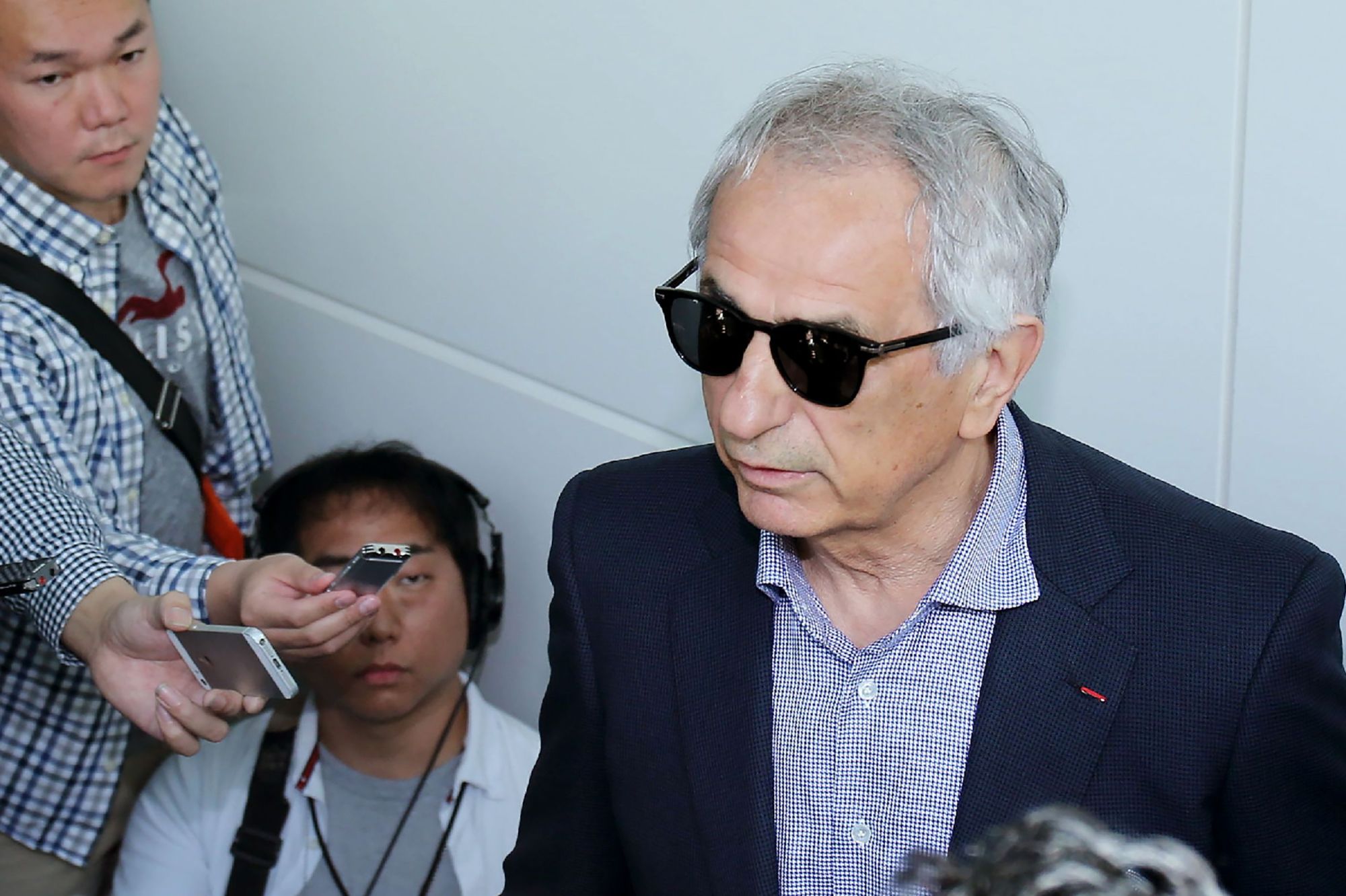 Former Japan men's soccer manager Vahid Halilhodzic speaks to journalists at Haneda airport on Saturday. | AFP-JIJI