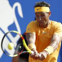 Rafael Nadal plays a shot against Martin Klizan in the Barcelona Open men\'s quarterfinals on Friday. | AP