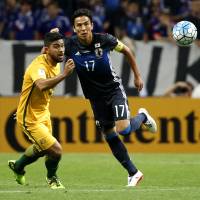 Japan captain Makoto Hasebe (right), seen in a file photo from August 2017, says he feels responsible for manager Vahid Halilhodzic\'s ouster, which was announced on Monday. | AP