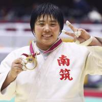 Akira Sone celebrates after winning the national women’s judo championship on Sunday in Yokohama. | KYODO