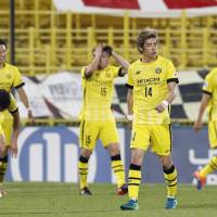 Reysol players react after allowing a second goal during their Asian Champions League match against Jeonbuk Motors on Wednesday night. | KYODO