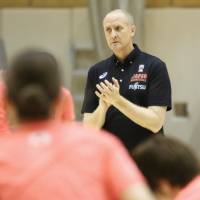 Japan women\'s national team head coach Tom Hovasse watches his players during a training camp at Tokyo\'s National Training Center on Tuesday. | KAZ NAGATSUKA